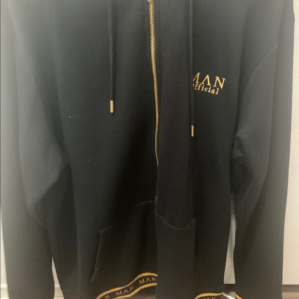 Gold zip through hoodie with intarsia hem